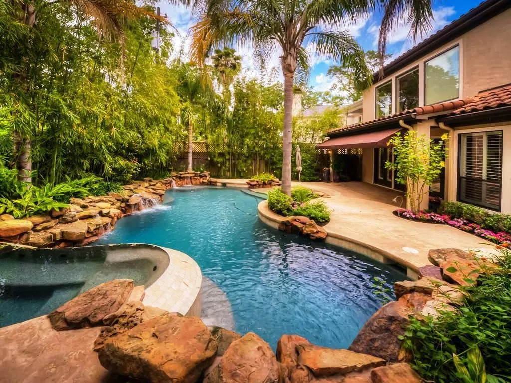 Lush landscaped lagoon pool